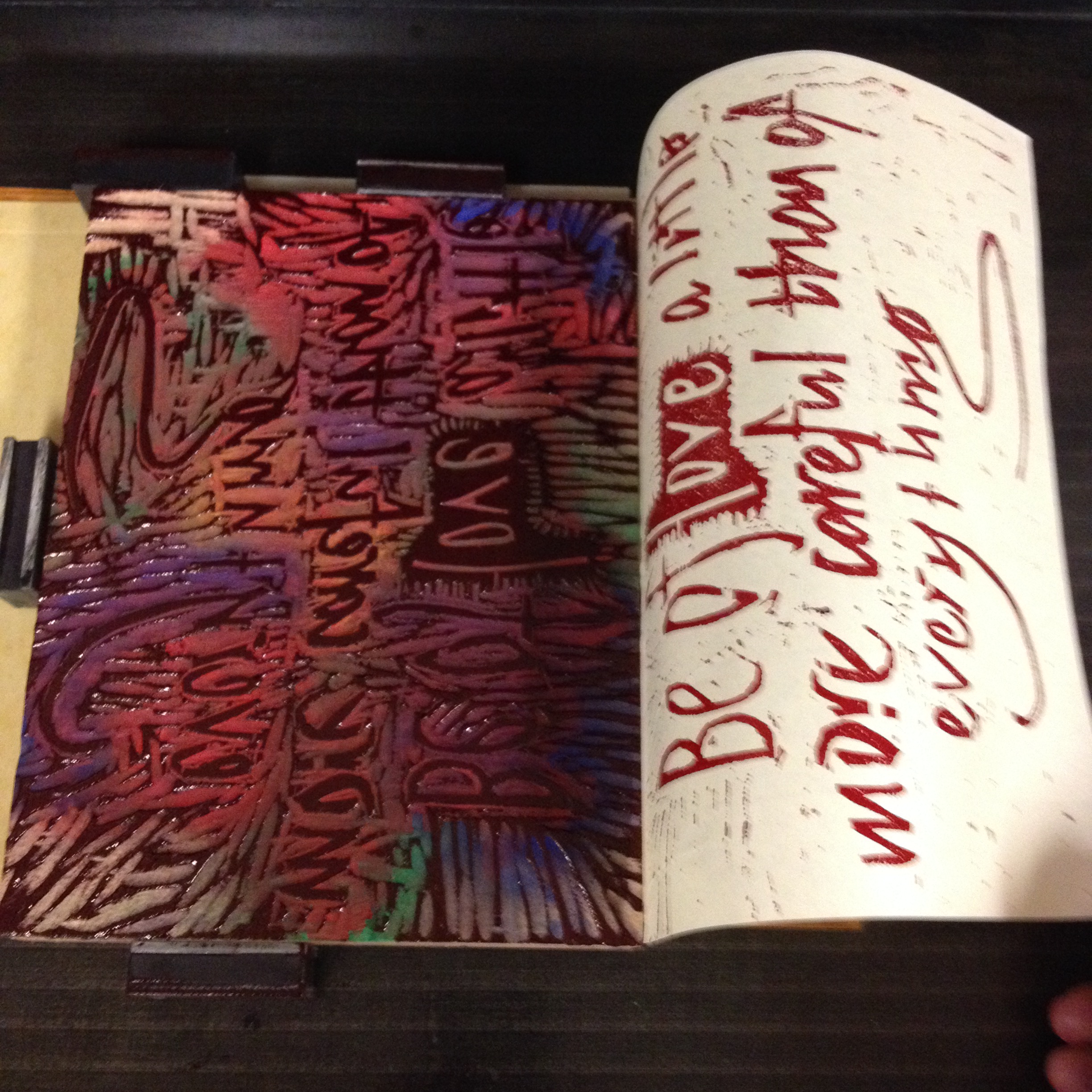 Woodblock, on press with print pulled away from block.